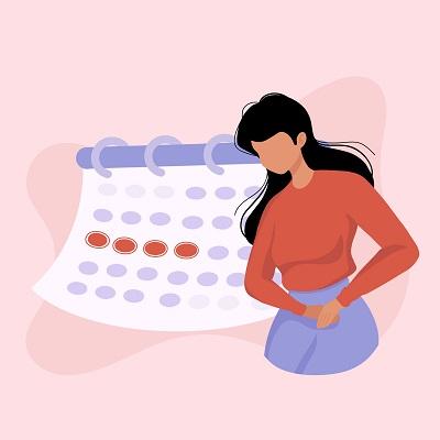一个女人站在日历前，日历显示这个女人来例假了。